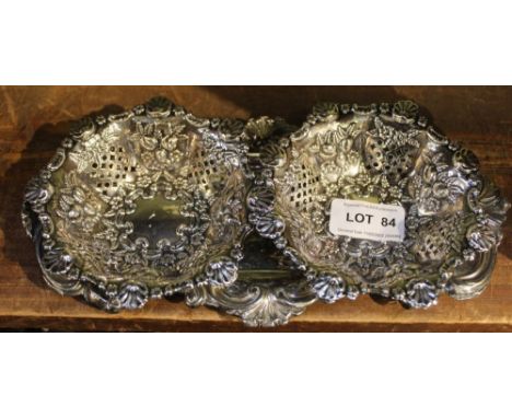 A 19th-century silverplated snuffer dish, together with two repousse and pierced silver baskets 