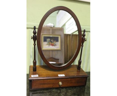 A 20th century mahogany finished adjustable oval plain plate dressing table mirror on box base fitted single jewellery draw 