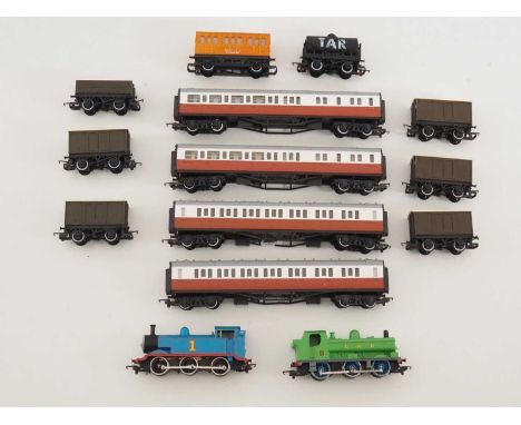 A group of HORNBY OO gauge 'Thomas the Tank Engine' series rolling stock including Thomas, Duck, James's coaches and other wa