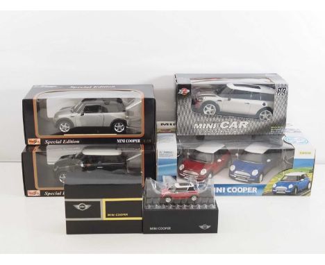 A group of various scale diecast and radio control BMW Mini automobiles, to include MAISTO - VG in VG boxes - RC models untes