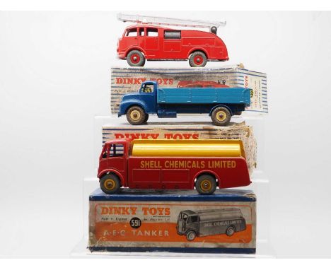 A group of DINKY Toys comprising a 932 Comet Wagon with hinged tail board - version with cream hubs, a 955 Fire Engine and a 