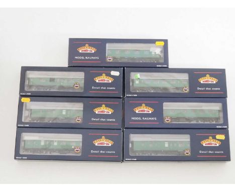 A group of BACHMANN OO gauge Mark 1 coaches in British Rail SR green livery - most are E - one coach has a missing window, in