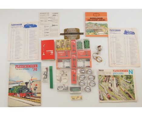 A quantity of FLEISCHMANN instruction manuals and price lists together with some N gauge model railway accessories by FLEISCH