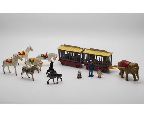 A CHARBENS traveling zoo set, with elephant, x2 cages, zoo keeper, x2 lions and x2 polar bears, plus assorted other animals -