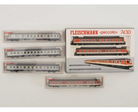 A FLEISCHMANN N gauge 7430 DMU 2-car train pack together with a centre coach (7431) and a Silberlinge 3-car push-pull set in 