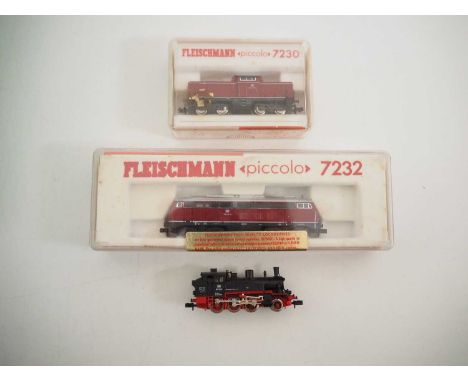 A group of three FLEISCHMANN N gauge locomotives comprising 7230 and 7232 diesel locomotives together with an unboxed BR91 st