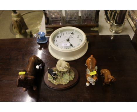 A Goebel dog; and a Beswick dog; together with a wall clock etc.