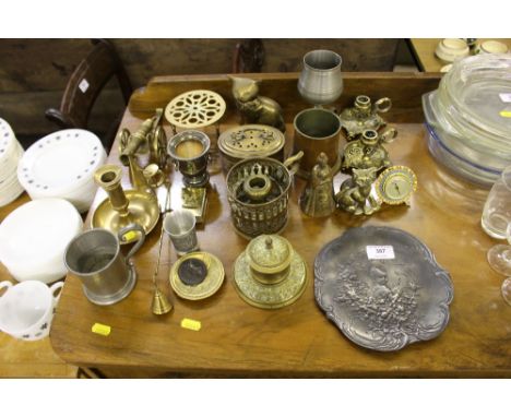 A quantity of various metalware to include a miniature brass cannon, a chamber stick, trivet stand, a pewter plate etc.