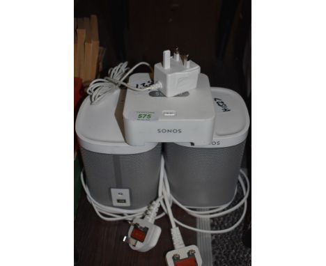 A modern Sonos unit and two Sonos Play 1 speaker units