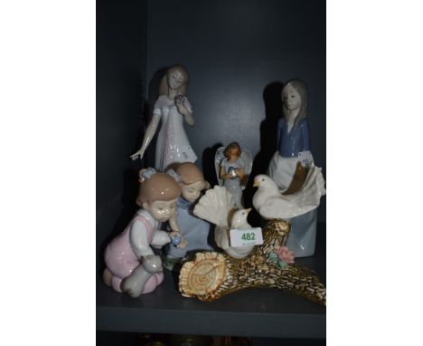 A selection of Spanish figures including Nao flower girl and similar dove birds