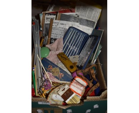 A box full of vintage and antique haberdashery including early knitting and crotchet patterns,crotchet edging,embroidery silk