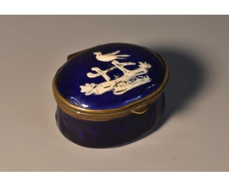 A George III South Staffordshire enamel oval patch box, of 'Wednesbury' type, hinged cover painted in raised opaque with a bi
