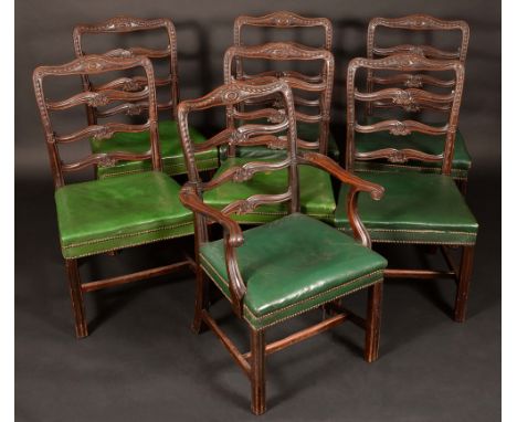 A set of six 19th century mahogany dining chairs, in the Adam taste, the ladder backs carved in relief with bell husk swags, 