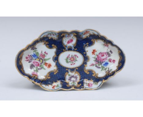 A Worcester lobed hexagonal form spoon tray, painted with panels of flower sprays within gilt scrolled borders, reserved on a