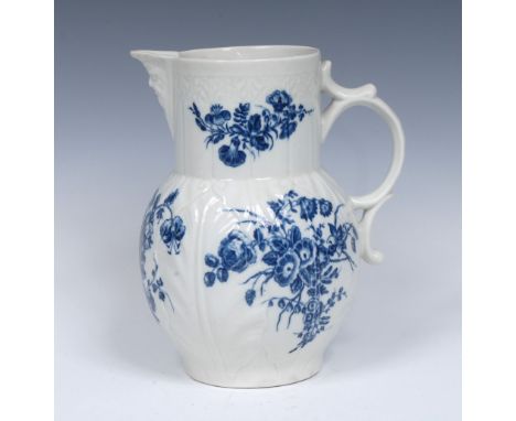 A Worcester Bouquets pattern Cabbage Leaf Mask jug, moulded with overlapping leaves, bearded mask spout, printed in cobalt bl