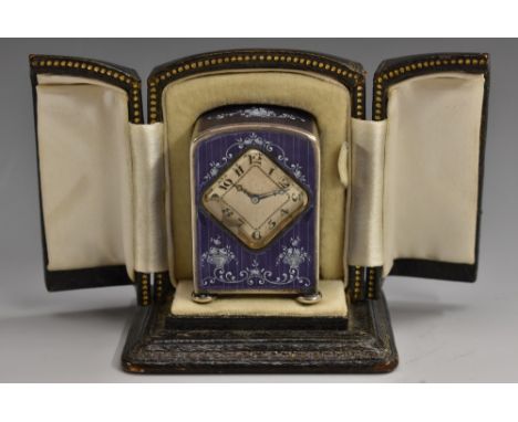 A continental silver and lilac enamel miniature timepiece, diamond shape silvered dial with Arabic numerals, the case decorat