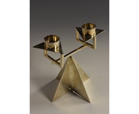 An Elizabeth II Modernist two-light candelabrum, cylindrical sconces, triform drip-pans, pyramidal base, 13.5cm high, Chelmsf