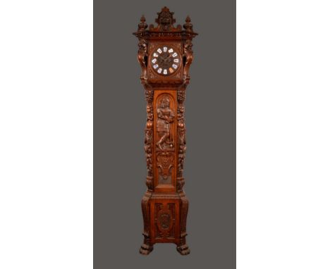 A 19th century German Baronial oak longcase clock, 25cm gadrooned convex dial with inset Roman numerals in shaped enamel plaq