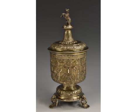 A Renaissance Revival silver standing cup and cover, in the 16th century German taste, dancing bear finial, profusely chased 