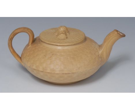 An early 19th century Wedgwood caneware teapot, basket weave moulding, the flat cover with wheatsheaf finial, 7.5cm high,  im