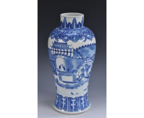 An early 19th century Chinese porcelain inverted baluster vase, well painted in underglaze blue with a panoramic landscape of