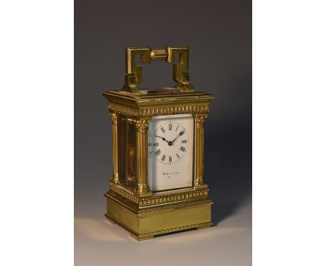 A late 19th/early 20th century brass miniature carriage clock, the white face with Roman numerals, inscribed Martin and Sons,