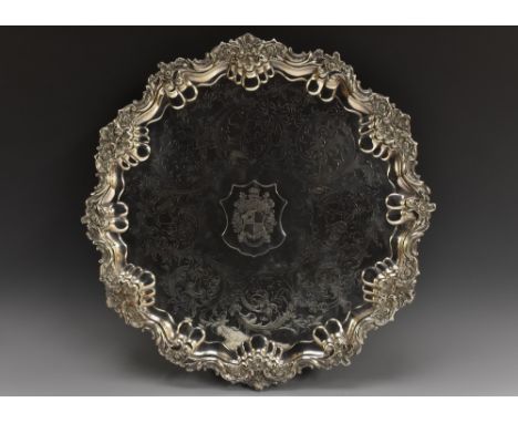 A large Victorian shaped circular tray, the field applied with Wier Clan crest, engraved and chased with foliate scrolls, the
