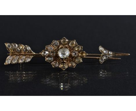 A 19th century Russian diamond set arrow brooch, central oval panel of fifteen old rough and rose cut diamonds, between confo