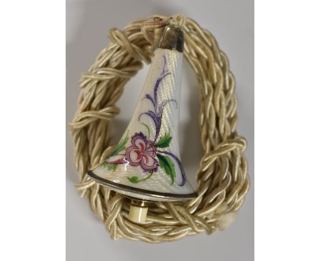 An early 20th century silver and enamel bell bush, decorated in polychrome with flowers on an opaque ground, 5cm long, c.1930