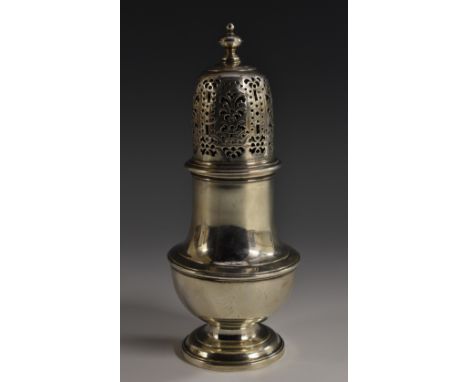 A George I silver pear shaped sugar caster, domed cover with knop finial, pierced and engraved with anthemions and strapwork,