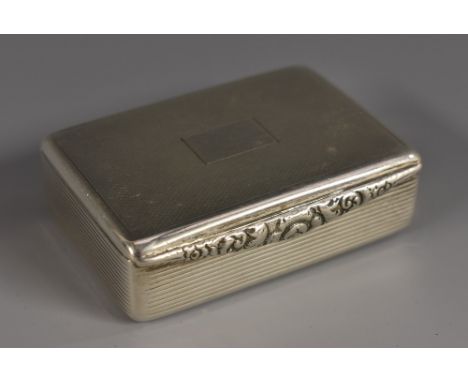 A George III style silver rounded rectangular snuff box, of good gauge, engine turned cover and base, reeded sides, foliate t
