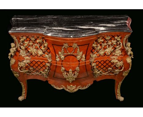 A Louis XV style gilt metal mounted bombe shaped commode, veined marble top above two long drawers, serpentine legs, lion paw