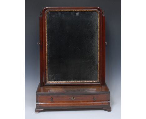 A George II/early George III parcel-gilt mahogany dressing glass, rounded rectangular tilting plate, concave moulded drawer t