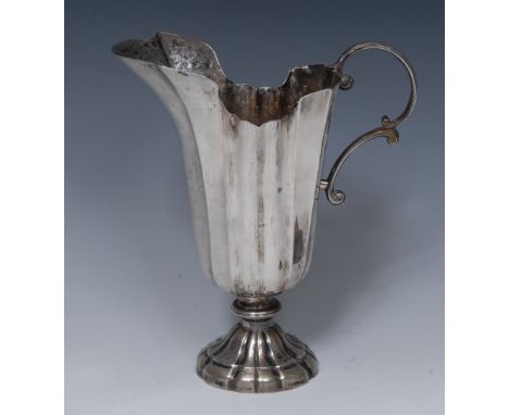 An 18th century Italian silver fluted helmet shaped ewer, double-scroll handle, domed foot, 22cm high, Rome, c.1770, 12oz