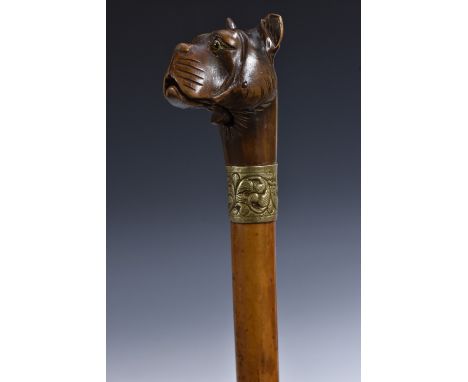 A 19th century novelty softwood and malacca automaton walking stick, the articulated softwood pommel as a dog's head with mec