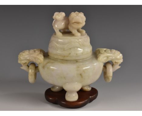 A Chinese mutton fat jade censer and cover, temple lion finial, loose-ring mask handles to sides, cabriole legs, 14.5cm wide,