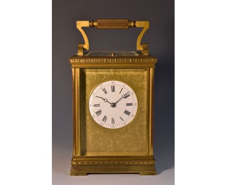An early 20th century French carriage clock, 5cm white enamelled dial, with Roman and Arabic numerals, within gilt plate engr