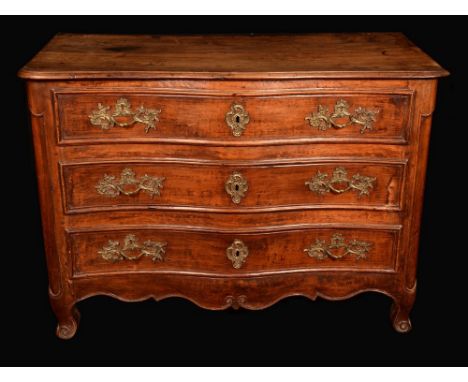A French Provincial fruitwood serpentine commode, moulded top above three long drawers, gilt metal Rococo handles and escutch