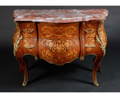 A Louis XV style gilt metal mounted kingwood and marquetry bombe shaped commode, rouge marble top above two long graduated dr