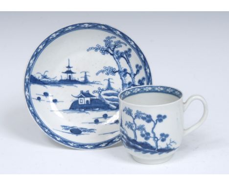 A Worcester Cannonball pattern coffee cup and saucer, strap grooved handle, painted in underglaze blue with islands with tree