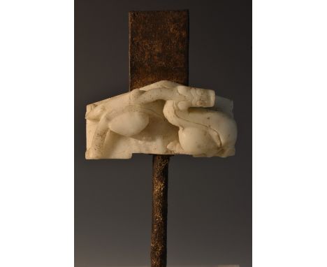 A Chinese opaque white jade basket-hilt, from a short ceremonial sword, boldly carved in the archaic manner recto and verso w