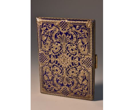 An Austrian silver-gilt and enamel rectangular cigarette case, engraved with leafy scrolls and trellis on a blue royale groun