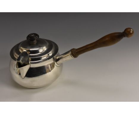 A George III Irish silver brandy saucepan and cover, knop finial, hinged cap to spout, turned fruitwood handle, 30cm wide ove