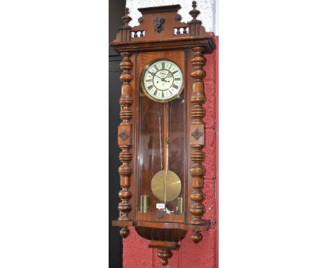 A 19th century Vienna walnut wall clock, 18cm enamel dial with Roman chapter, two winding holes, eight-day movement,  signed 