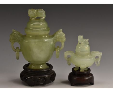 A Chinese jade miniature censer and cover, temple lion finial and loose ring handles, 11cm high, hardwood stand; another (2)