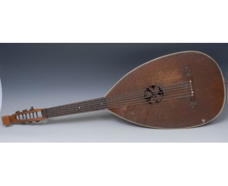 A lute, staved back, the sound hole carved with fruiting oak, ivory purfling, bone tuning pegs, 97cm long overall, 19th/early