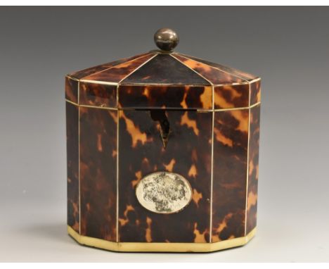 A George III decagon tortoiseshell tea caddy, ball finial, ivory banding, oval  cartouche,13cm high, c.1800