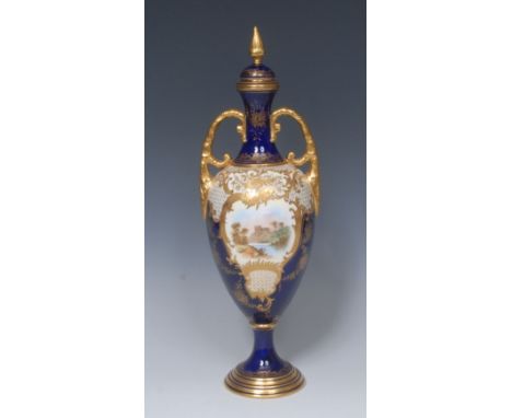 A Coalport Named View pedestal ovoid vase and cover, painted with castle ruins within a raised gilt cartouche, on a cobalt bl