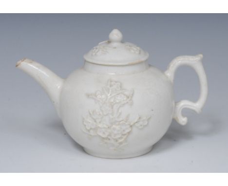 A Bow blanc de chine globular teapot, moulded in relief with blossoming prunus, domed cover with knop finial, acanthus-capped