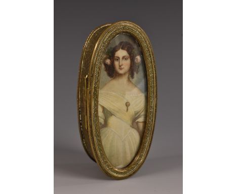 A 19th century French gilt-metal oval table bibelot, the hinged cover with an inset three-quarter length portrait miniature o